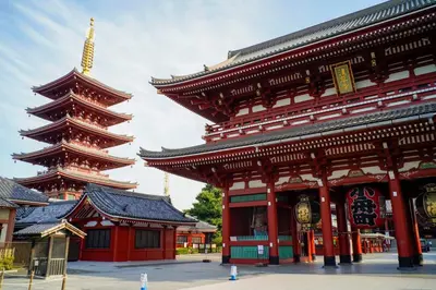a building with two pagodas in a city at SAUNALAND ASAKUSA in Tokyo