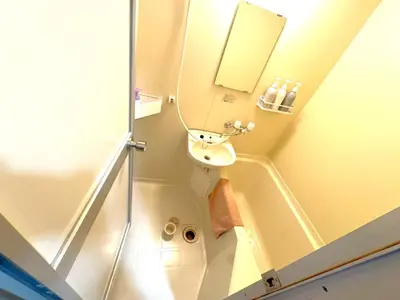 a small bathroom with a sink and a mirror at Green House Nakano Fujimicho - Vacation STAY 66008v in Tokyo