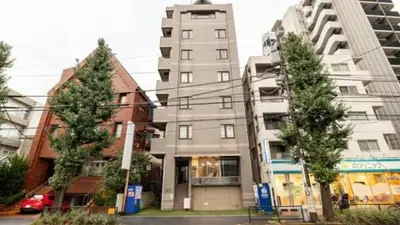 a tall apartment building with trees in front of it at Green House Nakano Fujimicho - Vacation STAY 66008v in Tokyo