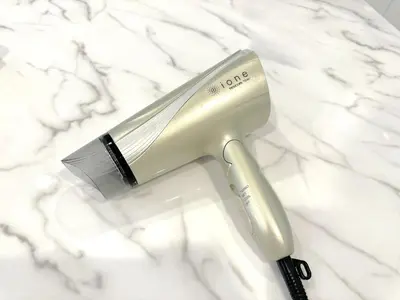 a hair dryer and a brush sitting on a counter at Green House Nakano Fujimicho - Vacation STAY 65981v in Tokyo