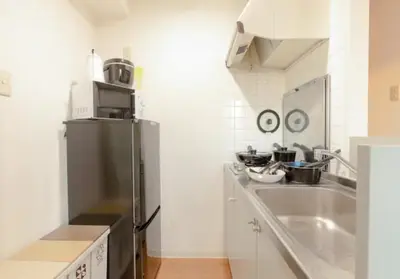 a kitchen with a stainless steel refrigerator and a sink at Green House Nakano Fujimicho - Vacation STAY 65981v in Tokyo
