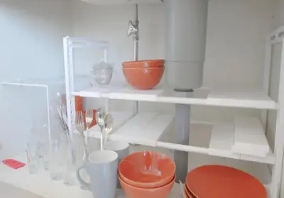 a shelf with bowls and other items on it at Green House Nakano Fujimicho - Vacation STAY 65988v in Tokyo