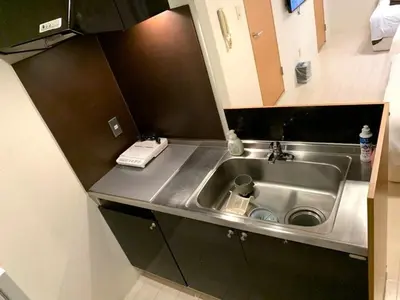 a small kitchen with a sink and a counter at Green House Nakano Fujimicho - Vacation STAY 65988v in Tokyo