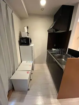 a small kitchen with a sink and a microwave at Green House Nakano Fujimicho - Vacation STAY 65988v in Tokyo