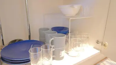 a bunch of glasses sitting on a shelf at Green House Nakano Fujimicho - Vacation STAY 65983v in Tokyo