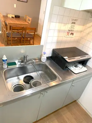 a kitchen counter with a sink and a microwave at Green House Nakano Fujimicho - Vacation STAY 65983v in Tokyo