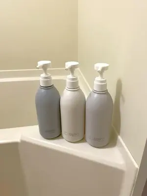 three white bottles sitting on top of a sink at Green House Nakano Fujimicho - Vacation STAY 65976v in Tokyo