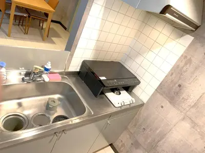 a kitchen counter with a sink and a microwave at Green House Nakano Fujimicho - Vacation STAY 65976v in Tokyo