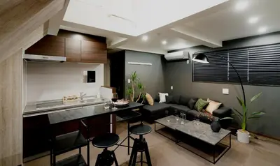 a kitchen and living room with a couch and a table at URBAN STAY SHINJUKU EAST - Vacation STAY 67914v in Tokyo