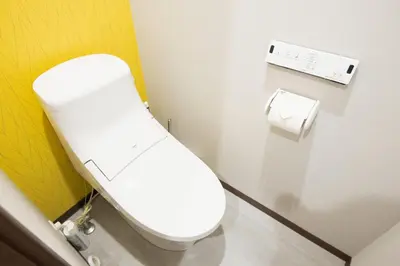 a white toilet in a bathroom with a roll of toilet paper at URBAN STAY SHINJUKU EAST - Vacation STAY 67909v in Tokyo
