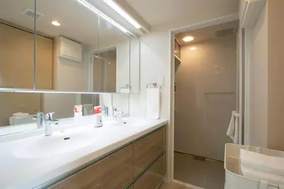 a bathroom with a white sink and a shower at Ostay Ueno in Tokyo