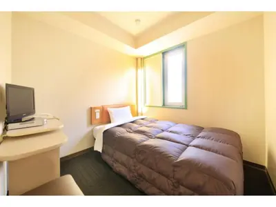 a bedroom with a bed in a room with a window at R&B HOTEL UENO HIROKOJI - Vacation STAY 39928v in Tokyo