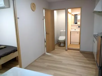 a small bathroom with a toilet and a door at Hitoyado Ryokan Higashiueno - Vacation STAY 72556v in Tokyo