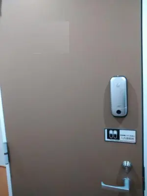 an iphone on the wall of a bathroom stall at Hitoyado Ryokan Higashiueno - Vacation STAY 72552v in Tokyo