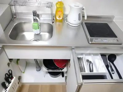 a kitchen counter top with a sink and a kitchenilit at Hitoyado Ryokan Higashiueno - Vacation STAY 72558v in Tokyo
