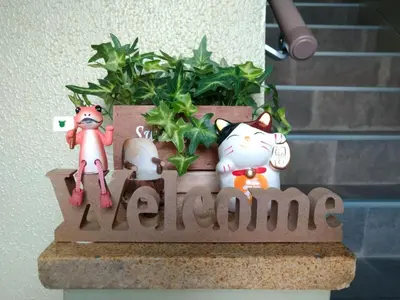 a planter with three cats and a plant at Hitoyado Ryokan Higashiueno - Vacation STAY 72541v in Tokyo