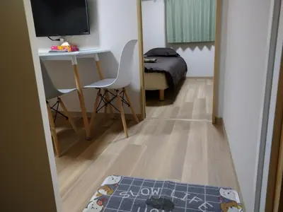 a small room with a desk and a bed at Hitoyado Ryokan Higashiueno - Vacation STAY 72541v in Tokyo