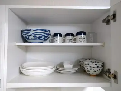 a pantry with blue and white cups and bowls at Hitoyado Ryokan Higashiueno - Vacation STAY 72534v in Tokyo