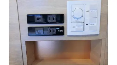 two electronic devices on a table with a box at Via Inn Iidabashi Korakuen in Tokyo