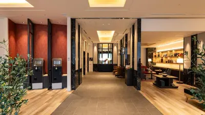 a corridor in a building with a lobby at Via Inn Iidabashi Korakuen in Tokyo