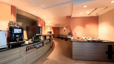 a restaurant with a counter and a bar at Via Inn Akihabara in Tokyo