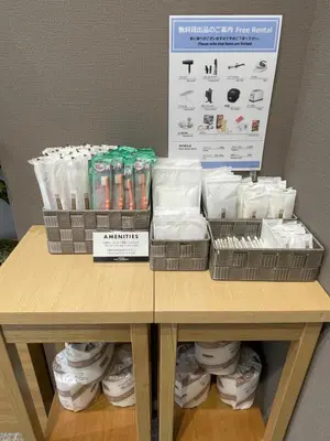 a table with two baskets of toilet paper and a box at ENT TERRACE Asakusa in Tokyo