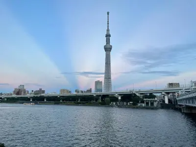 a view of a river with a bridge and a tower at ENT TERRACE Asakusa in Tokyo