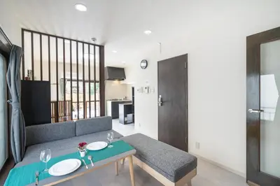 a living room with a couch and a table at Otsuka house with 2BR near the Yamanote line in Tokyo