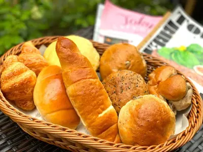 a basket of bread and pastries on a table at HOTEL TABARD TOKYO - Vacation STAY 64570v in Tokyo