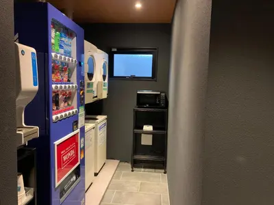 a kitchen with a refrigerator and a microwave at HOTEL TABARD TOKYO - Vacation STAY 64570v in Tokyo