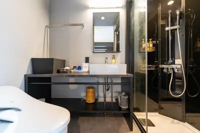 a bathroom with a sink and a shower at HOTEL TABARD TOKYO - Vacation STAY 64558v in Tokyo