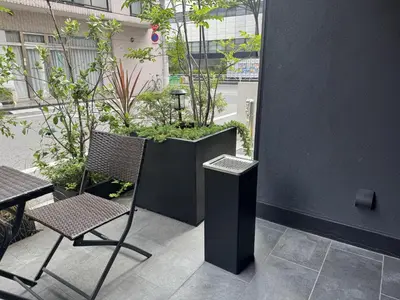 a chair and a trash can on a patio at HOTEL TABARD TOKYO - Vacation STAY 62622v in Tokyo
