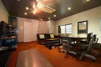 a living room with a dining room table and chairs at ABURA HAUS - Vacation STAY 13195 in Tokyo