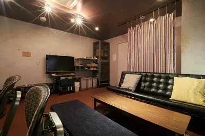 a living room with a couch and a television at ABURA HAUS - Vacation STAY 13195 in Tokyo