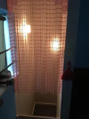 a bathroom with a shower with a pink curtain at ABURA HAUS - Vacation STAY 13195 in Tokyo