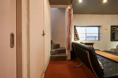 a room with a bed and a table and a window at ABURA HAUS - Vacation STAY 13195 in Tokyo