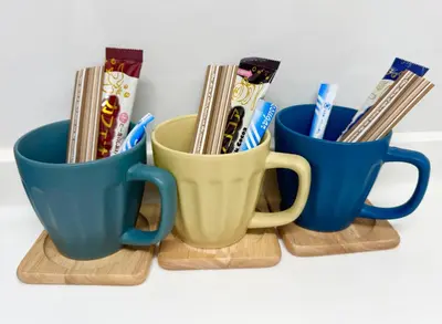 three cups filled with toothbrushes and toothpaste at Hotel chen's house - Vacation STAY 42508v in Tokyo