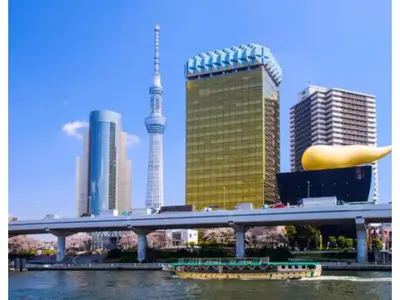a bridge over a river in a city with tall buildings at Hotel chen's house - Vacation STAY 42508v in Tokyo