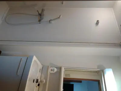 a bathroom with a shower head and a mirror at Ichijuku Ryokan Kaminarimon - Vacation STAY 75796v in Tokyo