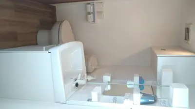 a white bathroom with a sink and a toilet at Ichijuku Ryokan Kaminarimon - Vacation STAY 75796v in Tokyo