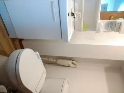 a white toilet in a bathroom with a mirror at Ichijuku Ryokan Kaminarimon - Vacation STAY 75796v in Tokyo