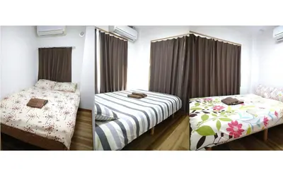 two pictures of a bedroom with a twin bed and a bedskirts at Ichijuku Ryokan Kaminarimon - Vacation STAY 75803v in Tokyo