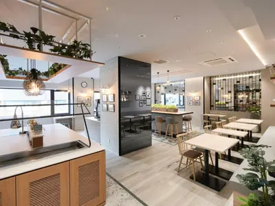 a kitchen and dining room with tables and chairs at Super Hotel Premier Ikebukuro Natural Hot Spring in Tokyo