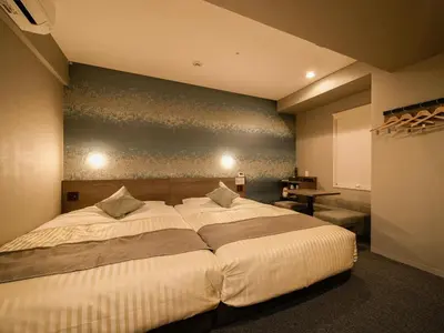 a bedroom with a large bed in a room at Super Hotel Premier Ikebukuro Natural Hot Spring in Tokyo