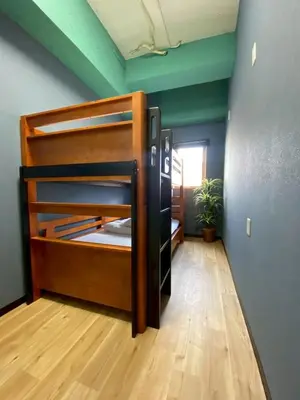 a room with a bunk bed in a room at STAY WORK ASAKUSA guest house \u6d45\u8349\u5e97 in Tokyo