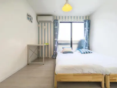 a bedroom with two beds and a window at japan house itabashi in Tokyo