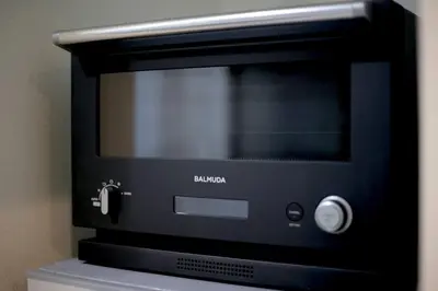 a black toaster oven sitting on top of a microwave at Pufuka Inn Skytree in Tokyo