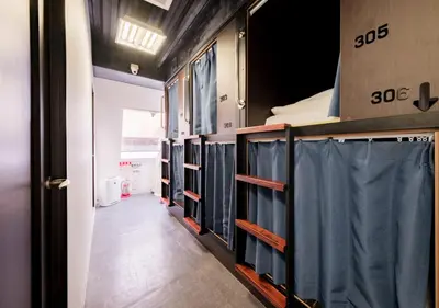 a row of bunk beds in a room at Hostel JAZ in Tokyo