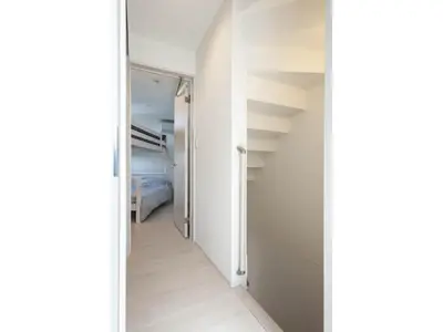 a hallway leading to a bedroom with white walls at Private Hotel Oshiage - Vacation STAY 81630v in Tokyo