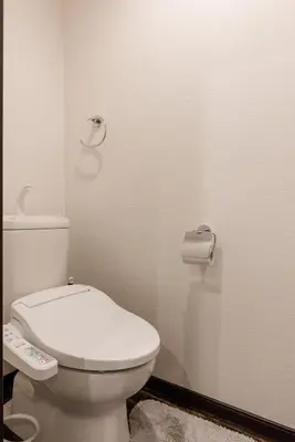 a bathroom with a toilet and a roll of toilet paper at Asakusa SAKURA-RYOKAN - Vacation STAY 88198v in Tokyo
